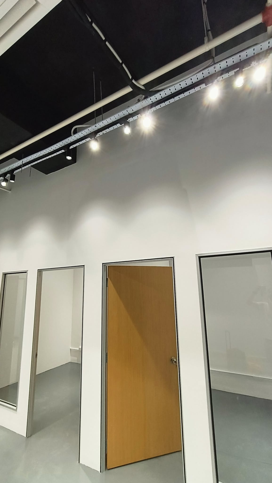 Studio partition fit-out with track lighting
