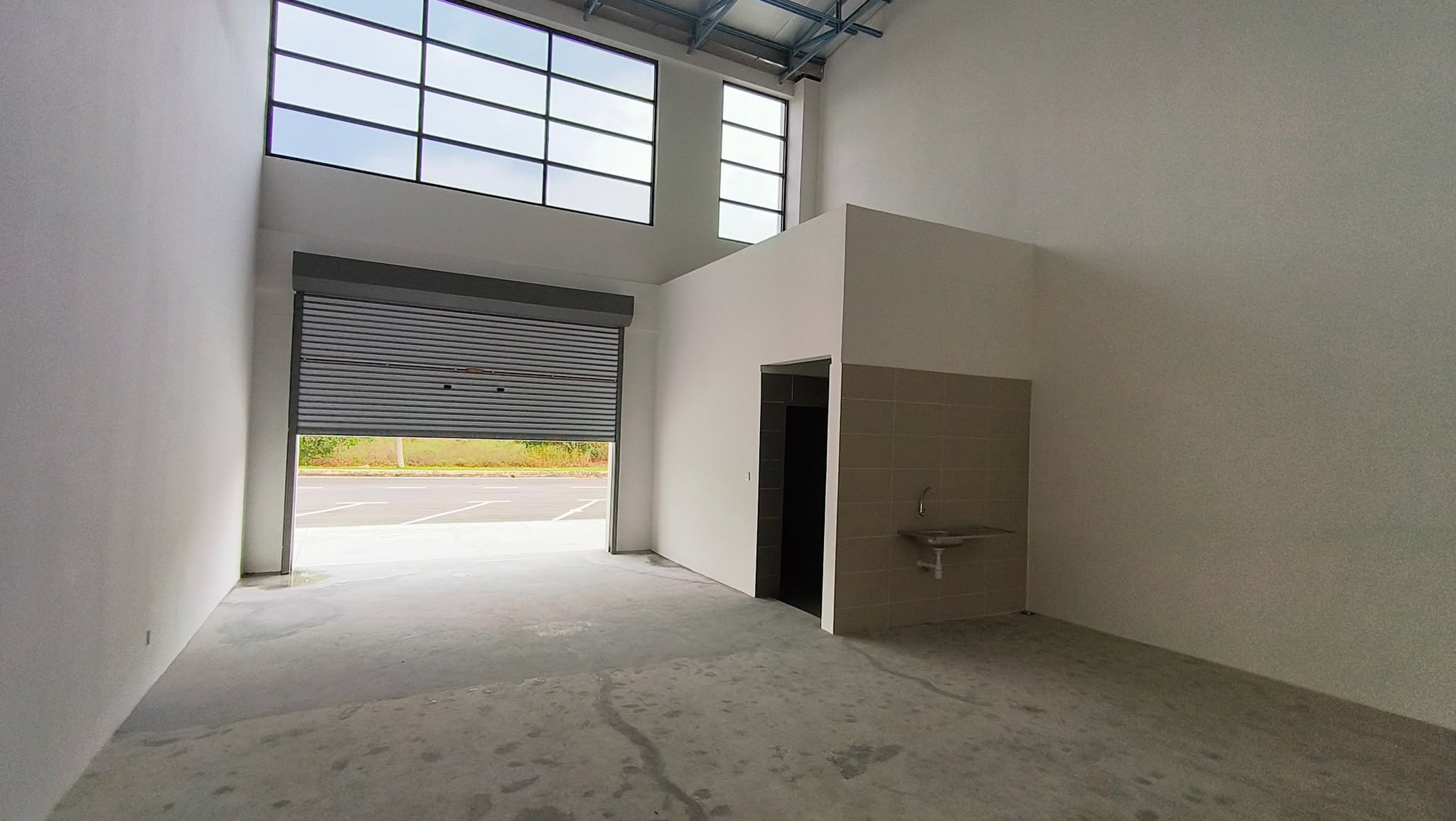 Empty warehouse unit before car workshop renovation