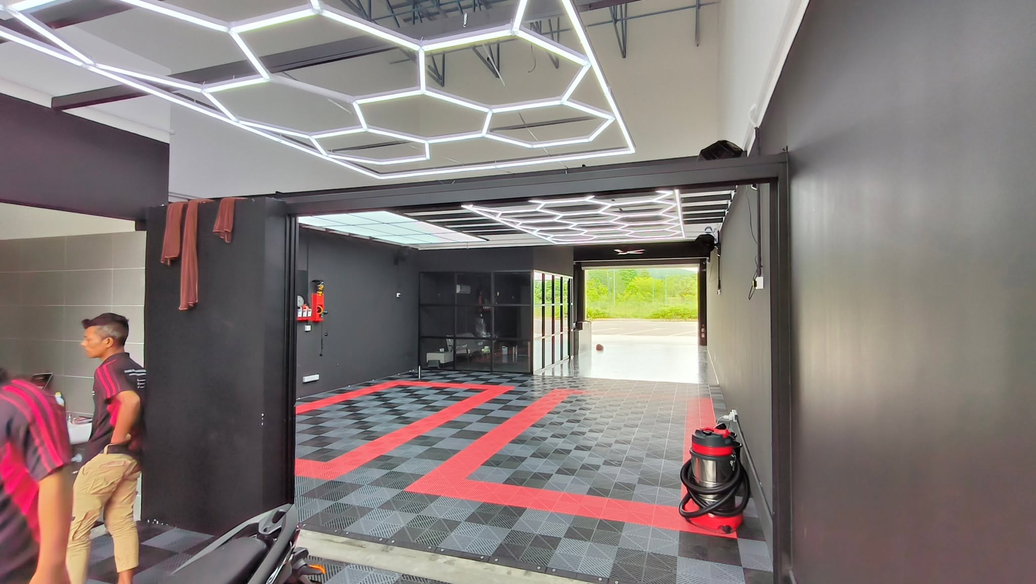 Car detailing workshop with hexagonal LED lighting