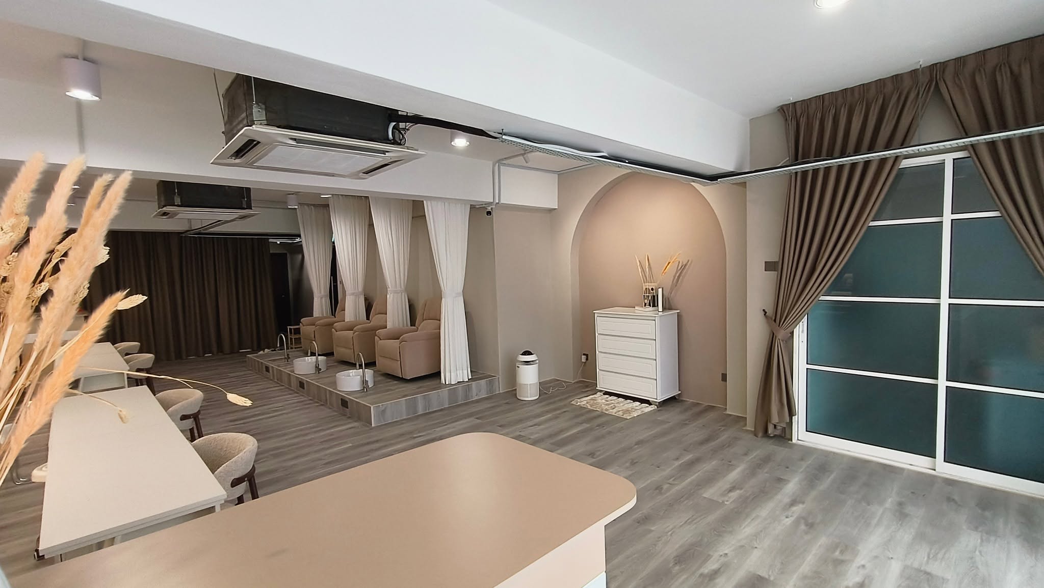 Salon interior with curtained treatment area