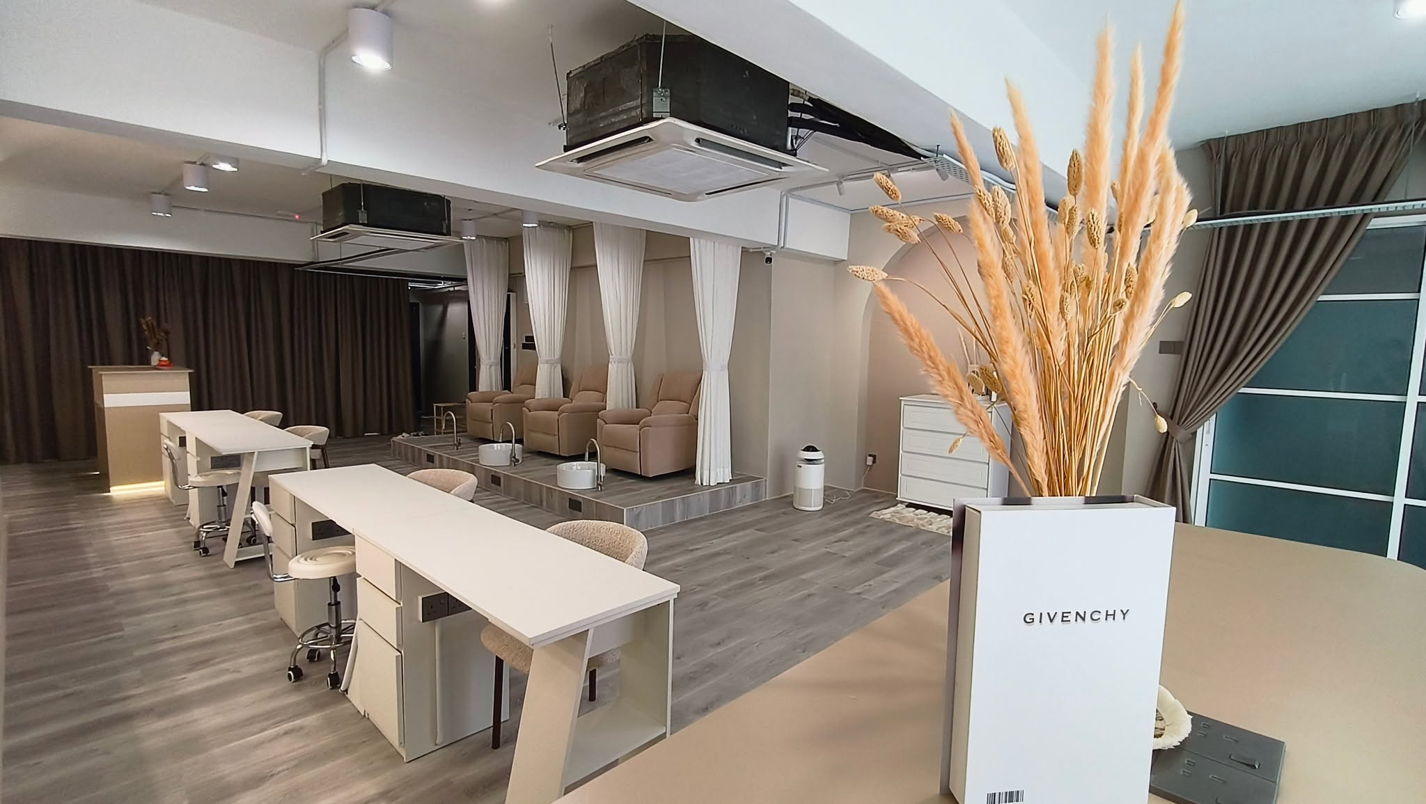 Manicure stations and pedicure area wide view